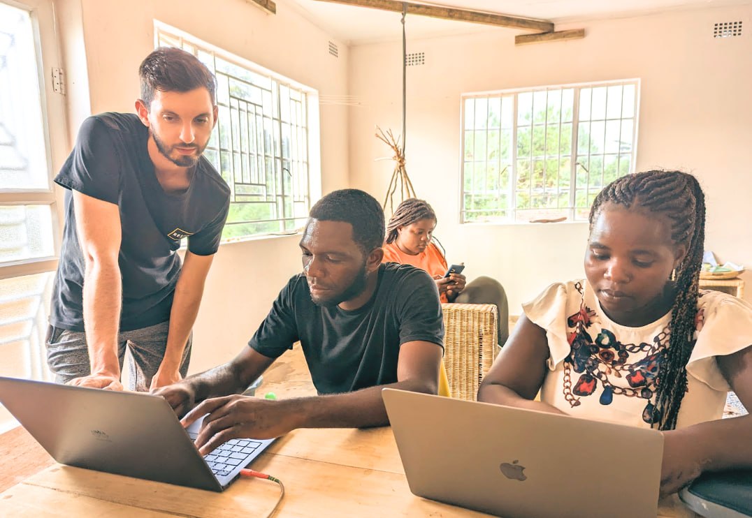 Simeon Max working with communities in the field